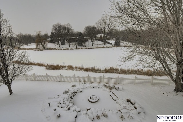 view of yard layered in snow