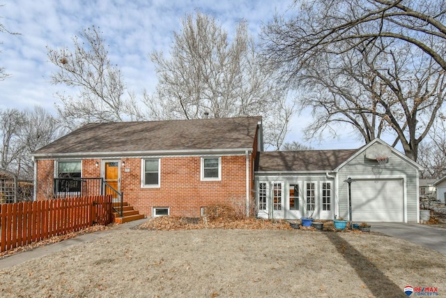 back of house featuring a garage