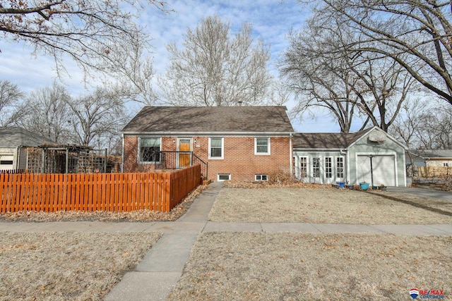 back of house with a garage