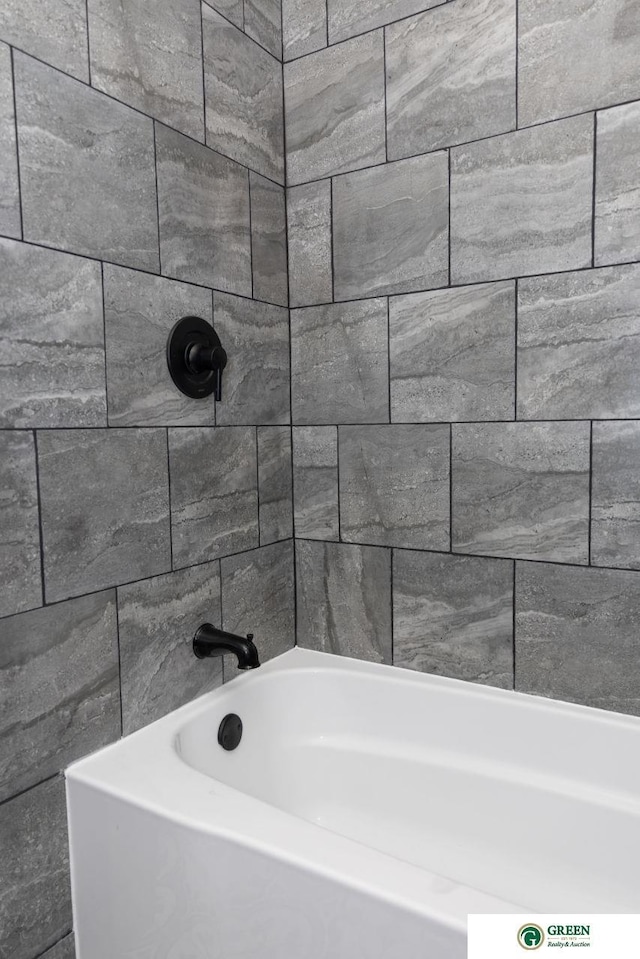 bathroom with a tub to relax in