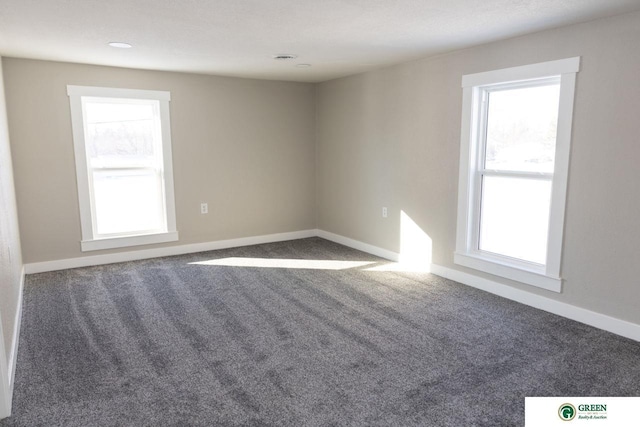 empty room featuring carpet flooring