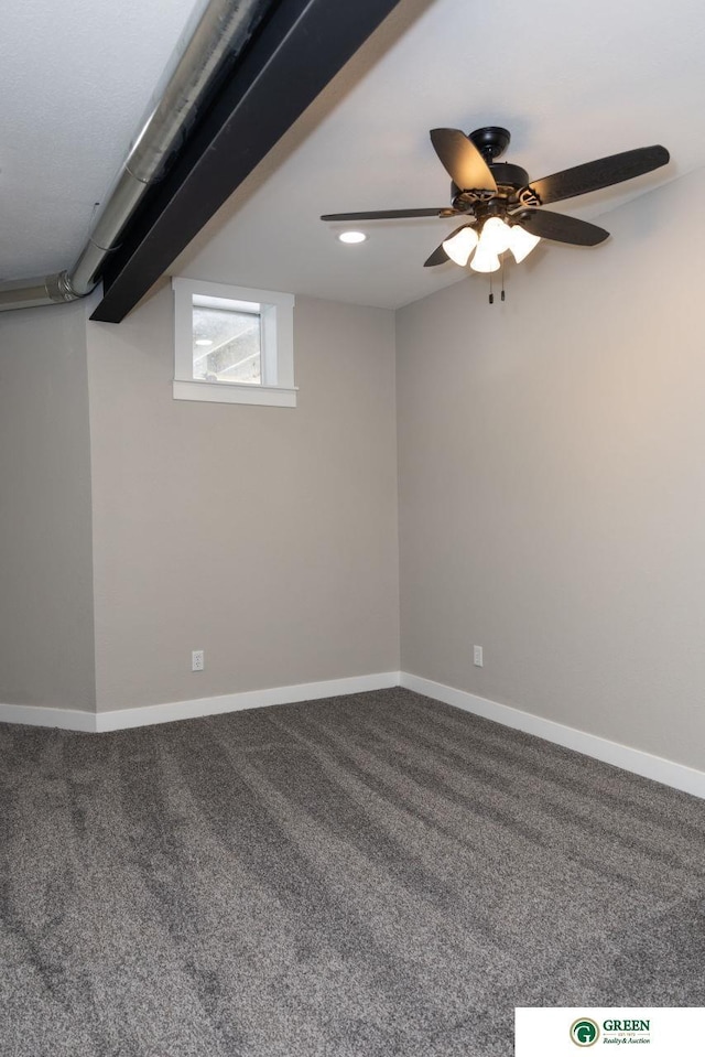 basement featuring ceiling fan and carpet