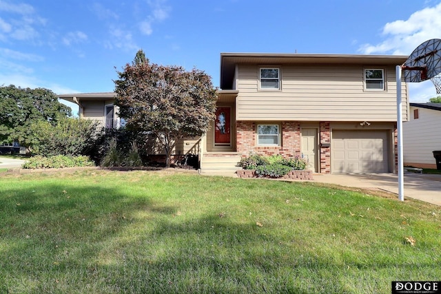 split level home with a front yard, brick siding, driveway, and an attached garage