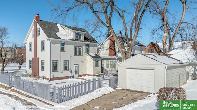 view of front of home with an outbuilding and a garage