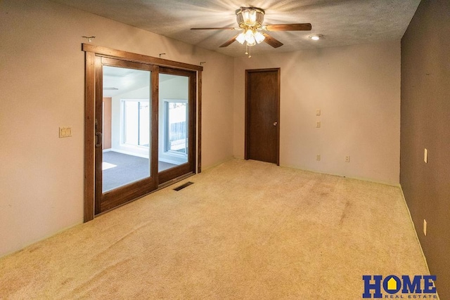 spare room with light colored carpet