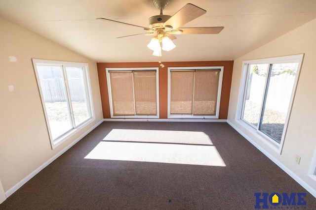 unfurnished sunroom featuring lofted ceiling, a wealth of natural light, and ceiling fan