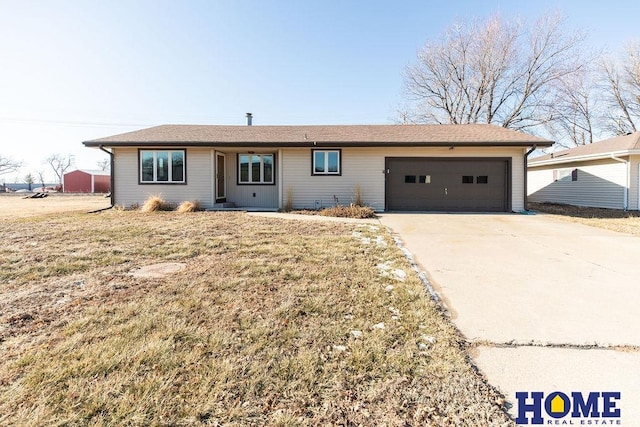 single story home featuring a garage and a front yard