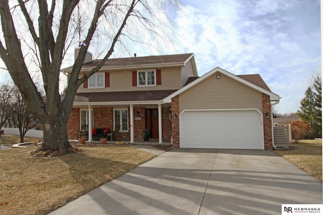 view of front of home featuring a garage and a front yard