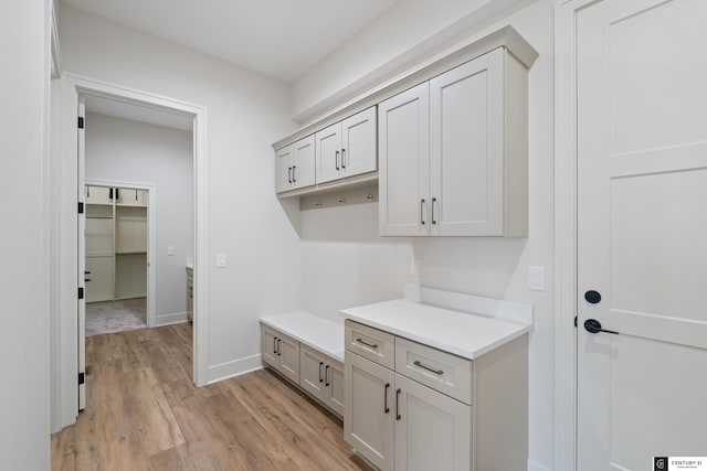 mudroom with light hardwood / wood-style flooring