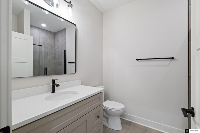 bathroom featuring walk in shower, tile patterned floors, vanity, and toilet