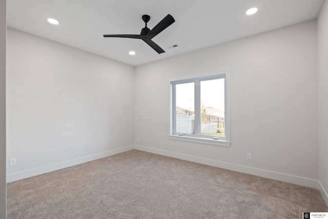 carpeted empty room with ceiling fan