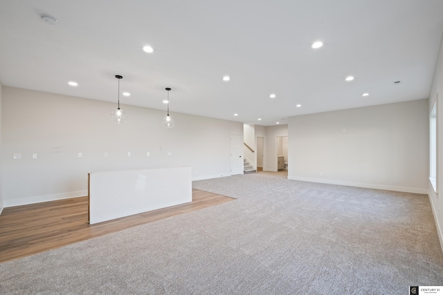 unfurnished room with light carpet