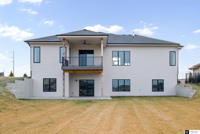 rear view of house featuring a patio, a yard, and ceiling fan