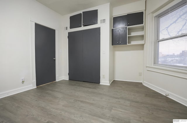 empty room featuring dark hardwood / wood-style flooring