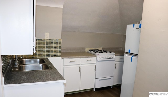 kitchen featuring dark hardwood / wood-style floors, tasteful backsplash, white cabinetry, sink, and white appliances