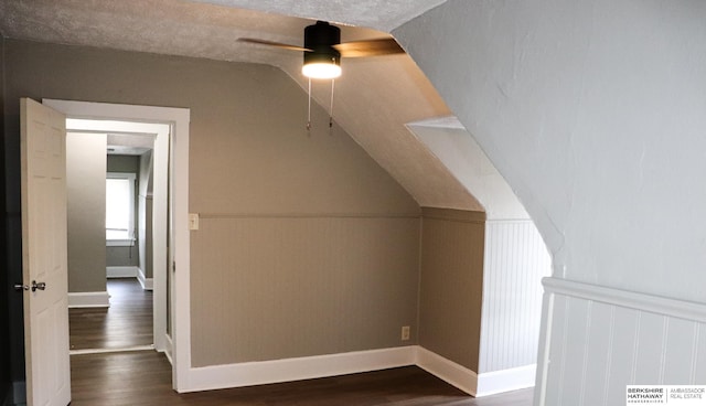 bonus room featuring dark wood-type flooring and ceiling fan