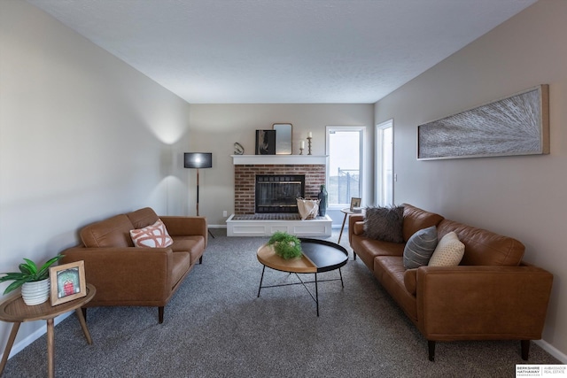 carpeted living room with a brick fireplace