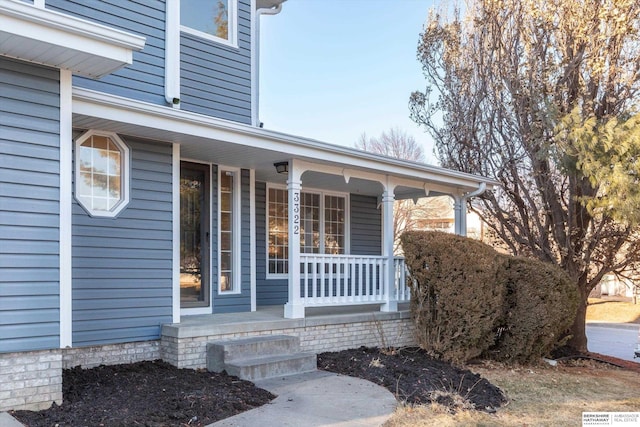 entrance to property featuring a porch