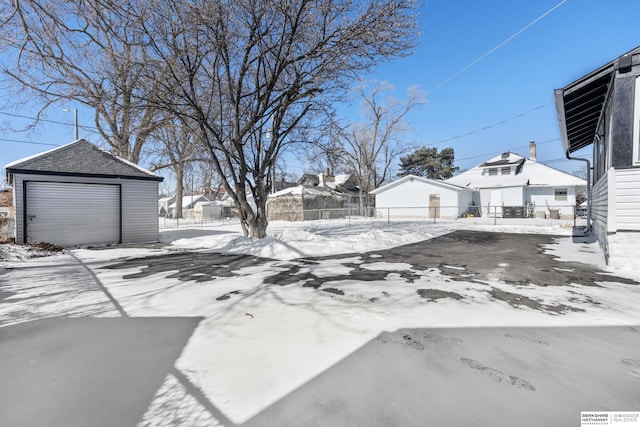 exterior space with an outbuilding and a garage