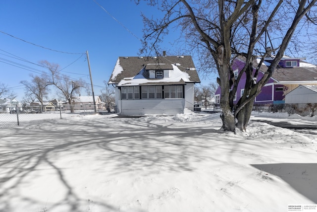 view of front of home featuring a sunroom