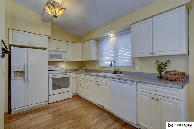 kitchen with sink, white appliances, light hardwood / wood-style flooring, white cabinets, and vaulted ceiling