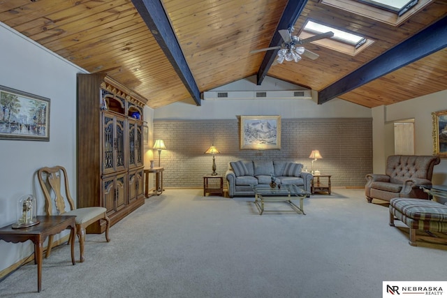 carpeted living room with lofted ceiling with skylight, brick wall, ceiling fan, and wood ceiling