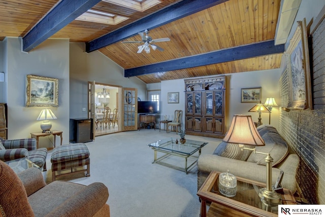 living room featuring lofted ceiling with beams, carpet flooring, ceiling fan with notable chandelier, and wooden ceiling