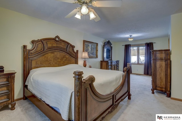 bedroom with light carpet and ceiling fan