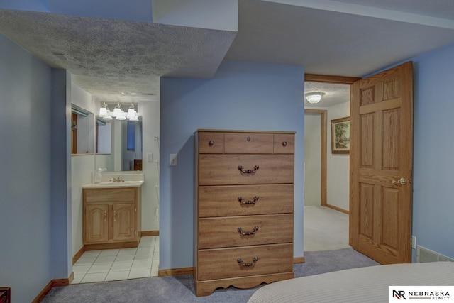 bathroom featuring vanity and a textured ceiling