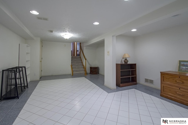 basement with light tile patterned floors