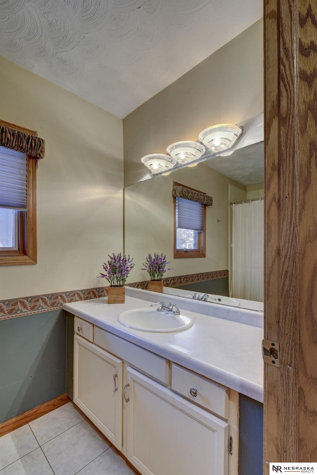 bathroom with vanity and tile patterned floors