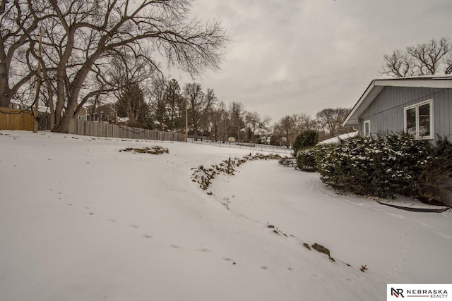 view of yard covered in snow