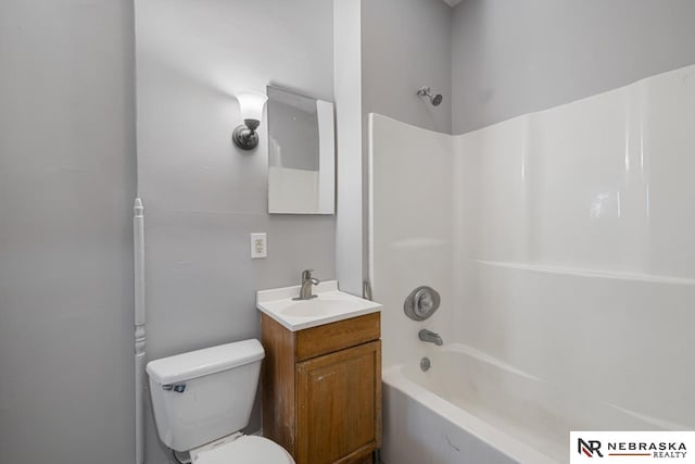 full bathroom with bathing tub / shower combination, vanity, and toilet