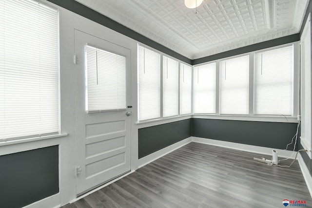 unfurnished sunroom with plenty of natural light