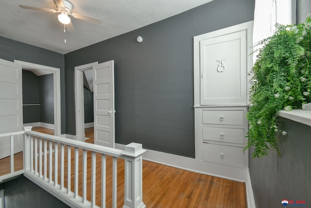 interior space with light hardwood / wood-style flooring and ceiling fan