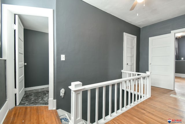 corridor with wood-type flooring