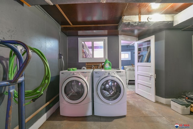 washroom featuring washer and clothes dryer