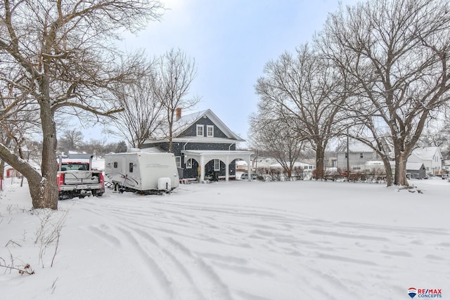 view of yard covered in snow