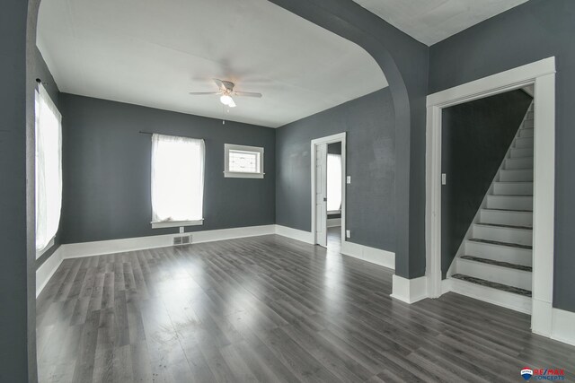 spare room featuring ceiling fan and dark hardwood / wood-style flooring