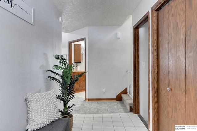 corridor with a textured ceiling