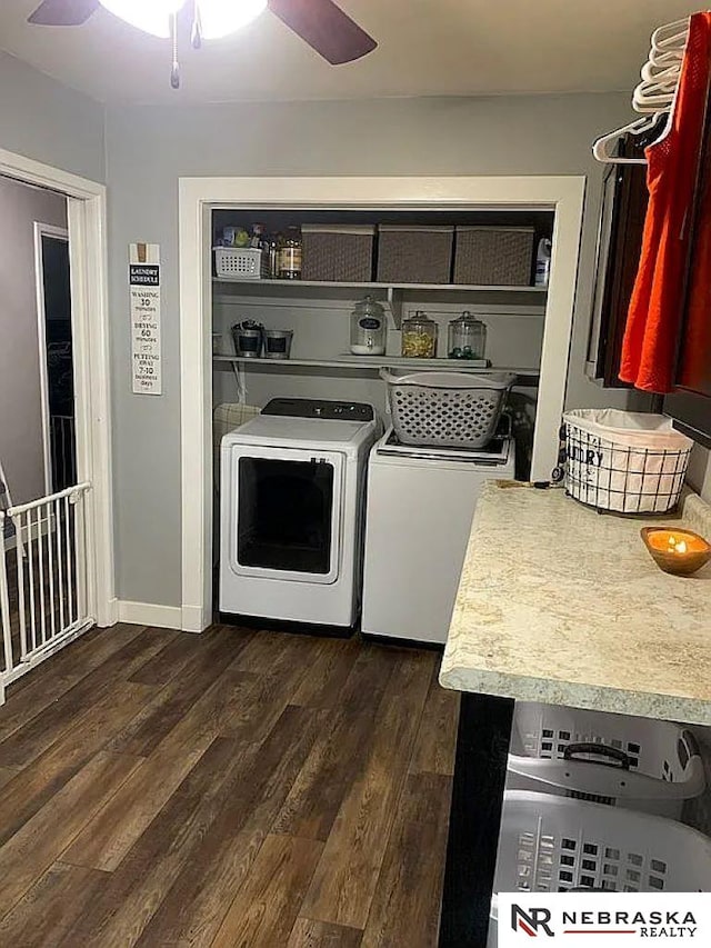 kitchen featuring dark wood-type flooring, ceiling fan, and separate washer and dryer