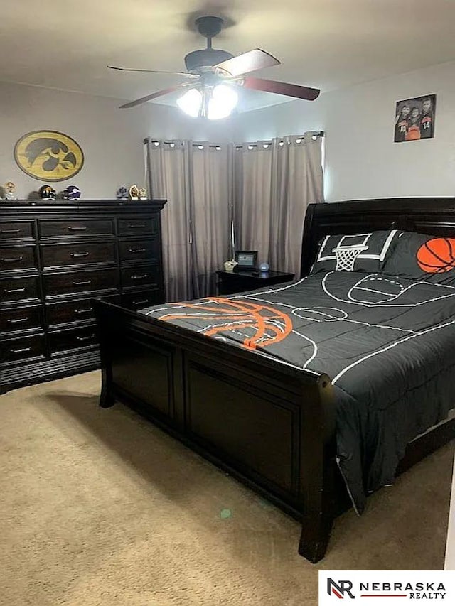 carpeted bedroom featuring ceiling fan