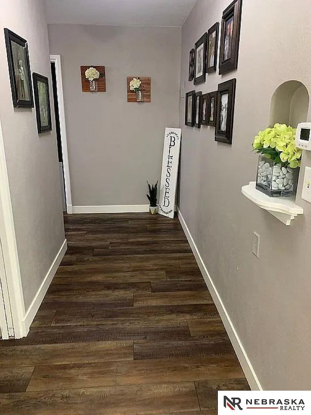 hall with dark hardwood / wood-style floors