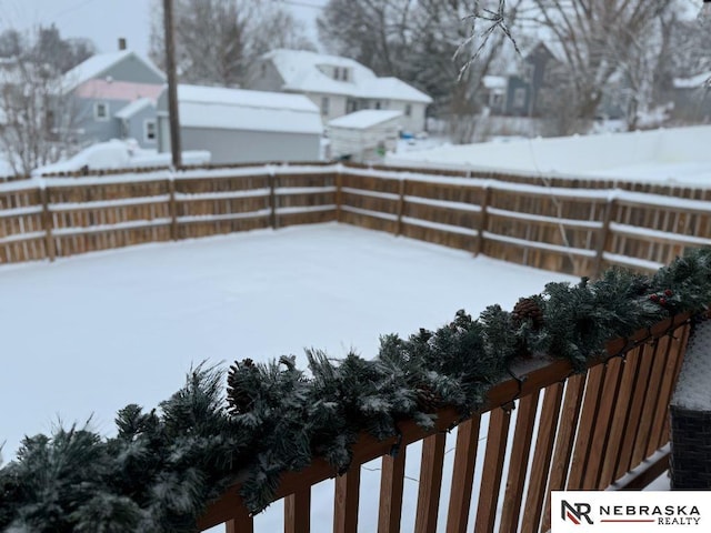 view of yard layered in snow