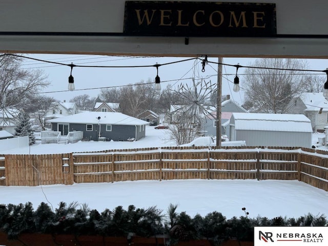 view of yard layered in snow