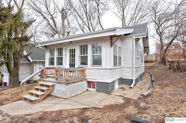 view of front of house with a shingled roof