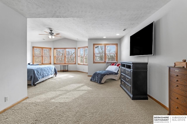 carpeted bedroom featuring lofted ceiling, ceiling fan, and a textured ceiling