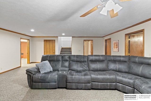 living room featuring crown molding, ceiling fan, and light carpet