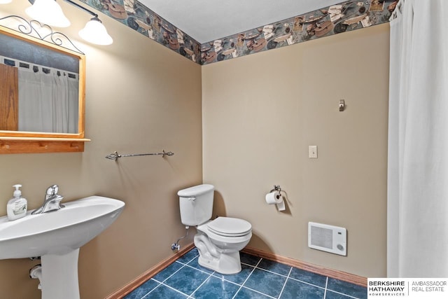 bathroom with tile patterned floors and toilet