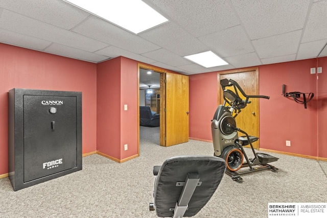 workout room with light carpet and a paneled ceiling